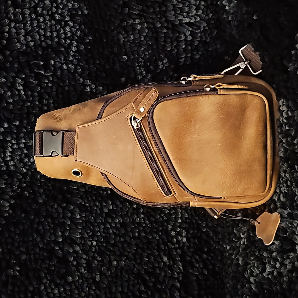 Mens light brown/tan leather slingbag NWOT also available in black